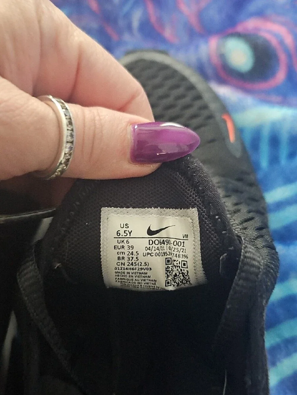 Nike Black Sneakers with Orange Accent and White Sole